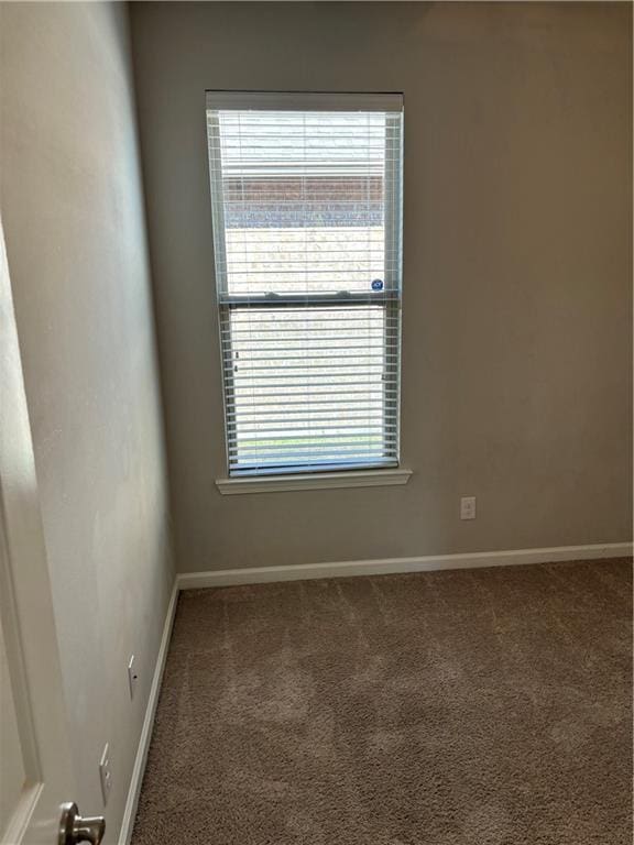 empty room with carpet floors and plenty of natural light