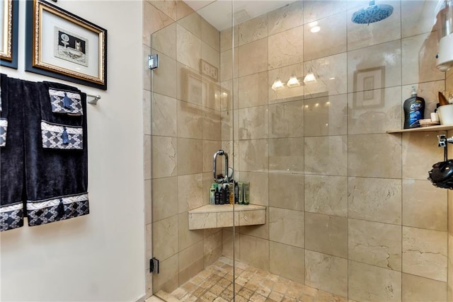 bathroom with a shower with shower door