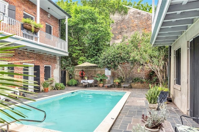 view of swimming pool featuring a patio