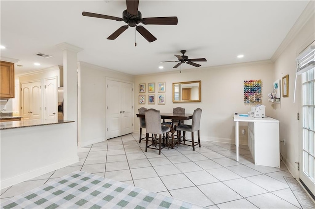 dining room with ornamental molding, light tile patterned flooring, and ceiling fan