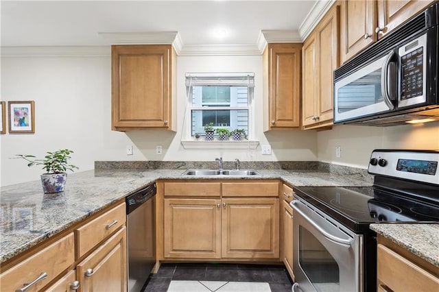 kitchen featuring dark tile patterned flooring, stainless steel appliances, sink, ornamental molding, and light stone counters