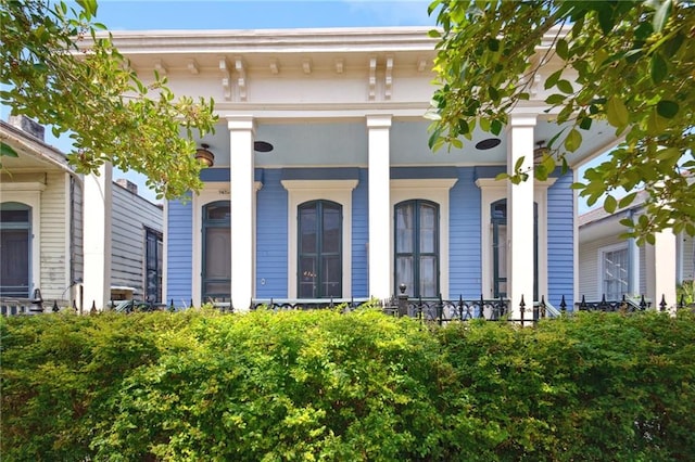 property entrance featuring covered porch