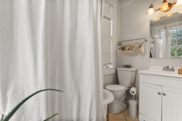 bathroom with tile patterned flooring, a bidet, vanity, and toilet