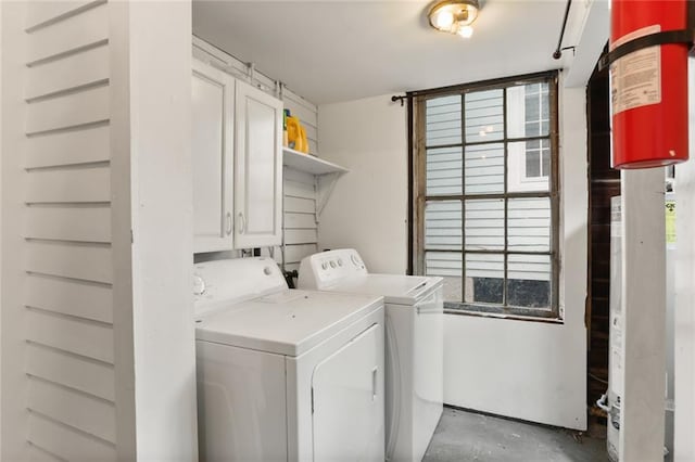 washroom featuring cabinets and washer and dryer