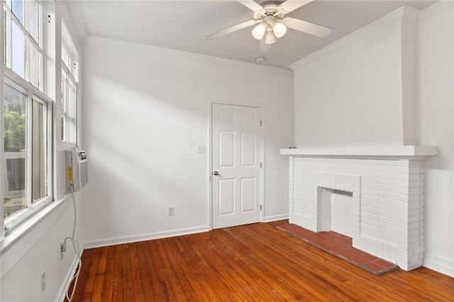 unfurnished living room with ceiling fan, cooling unit, ornamental molding, a brick fireplace, and hardwood / wood-style floors