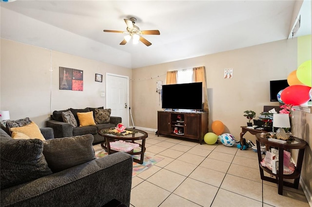 living room with ceiling fan and light tile patterned flooring