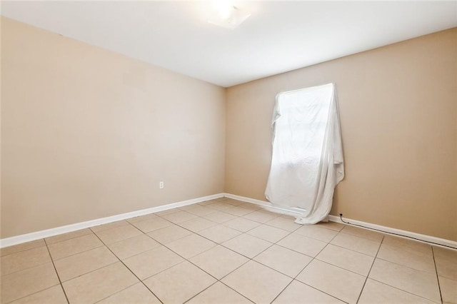 empty room featuring light tile patterned floors