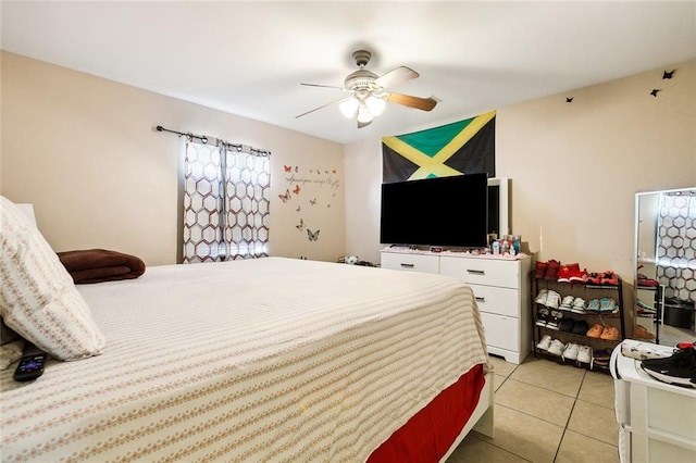 tiled bedroom with ceiling fan