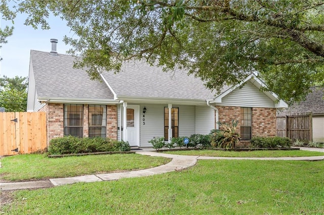 ranch-style home featuring a front yard