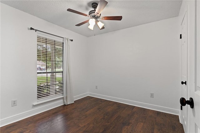 unfurnished room with dark wood-type flooring, ceiling fan, and a textured ceiling