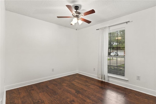 unfurnished room with a textured ceiling, dark hardwood / wood-style floors, and ceiling fan