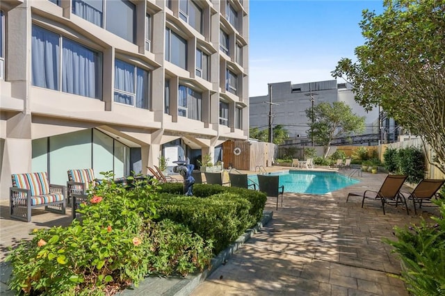 view of swimming pool with a patio area