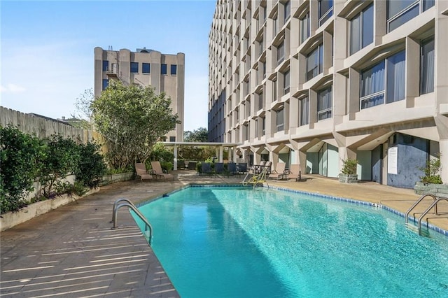 view of swimming pool with a patio