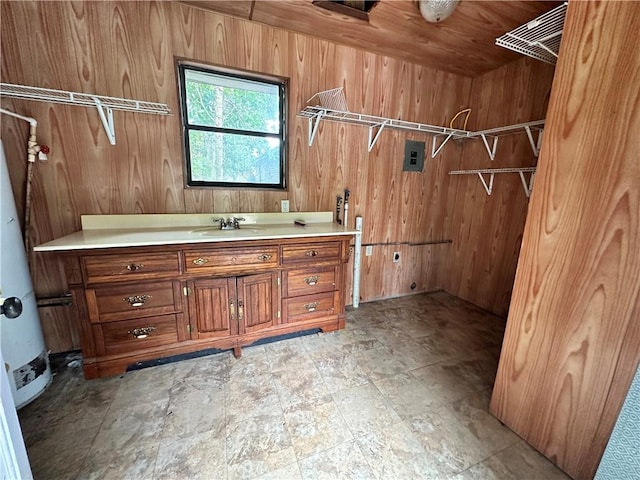 bathroom featuring vanity and wood walls