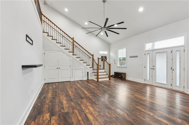 foyer entrance with high vaulted ceiling, hardwood / wood-style flooring, and ceiling fan