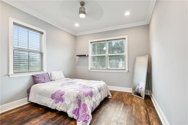 bedroom featuring ornamental molding, ceiling fan, and dark hardwood / wood-style floors