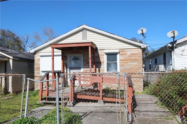 back of house with a deck