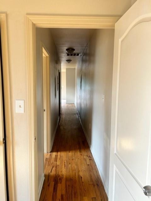 corridor featuring hardwood / wood-style floors