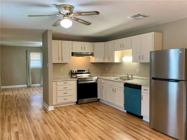 kitchen with sink, light hardwood / wood-style flooring, stainless steel appliances, and white cabinets