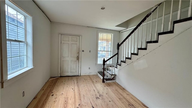 foyer featuring plenty of natural light and light wood-type flooring