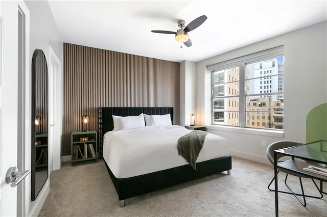 bedroom with ceiling fan and carpet