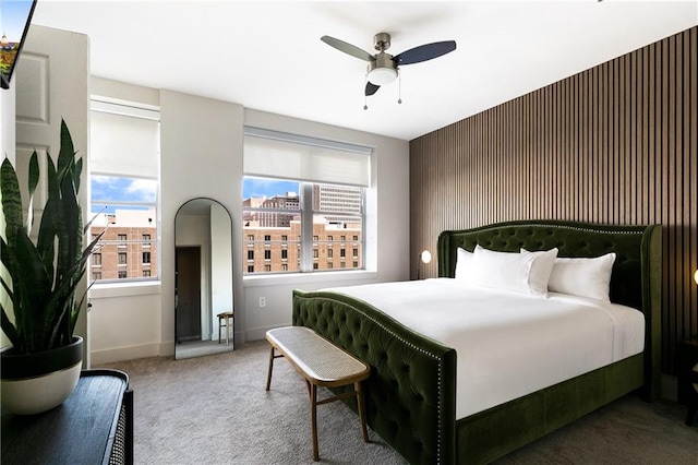 bedroom featuring ceiling fan and carpet flooring