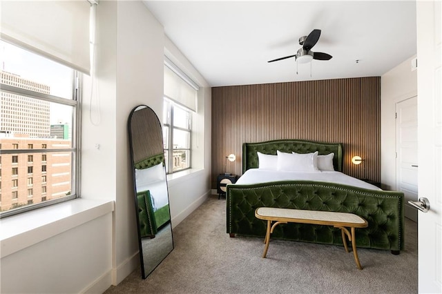 bedroom featuring ceiling fan and carpet