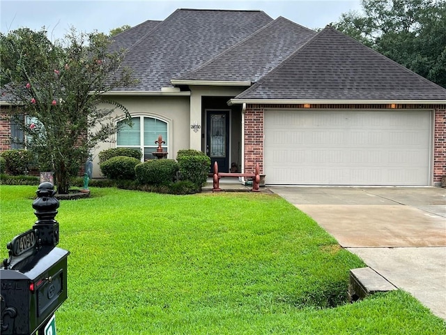 single story home with a front yard and a garage