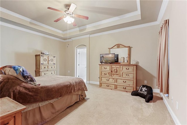 bedroom with ceiling fan, crown molding, and carpet