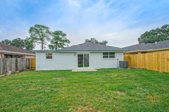 back of property featuring a patio area, a lawn, and central air condition unit