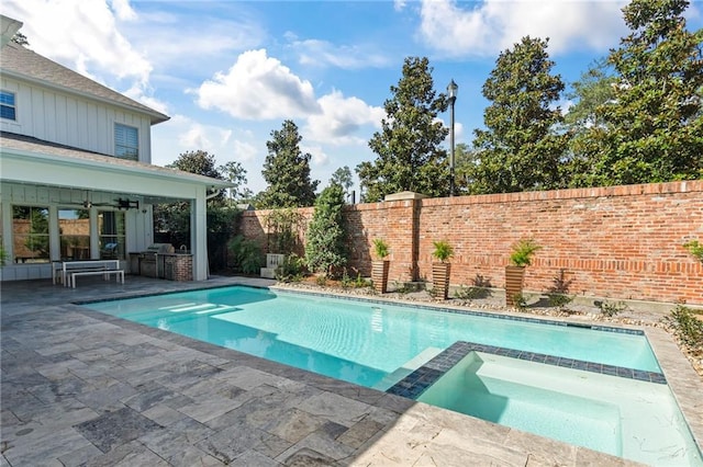 view of pool featuring an in ground hot tub, ceiling fan, and a patio area