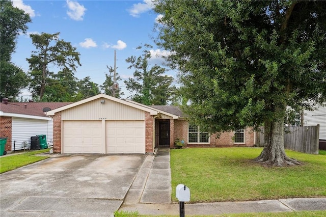 single story home featuring a garage and a front lawn