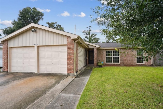 ranch-style house featuring a garage and a front lawn