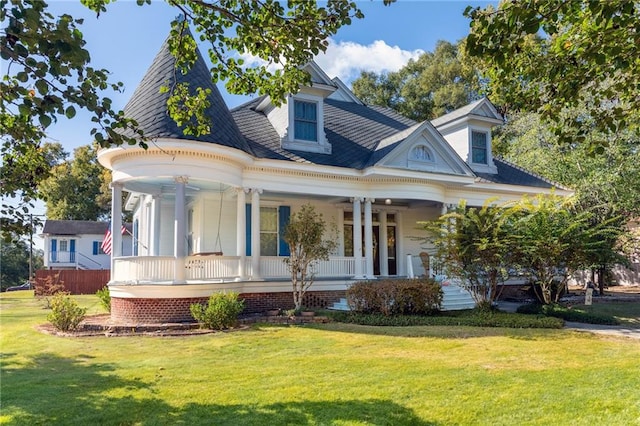 view of front of house with a front lawn and covered porch