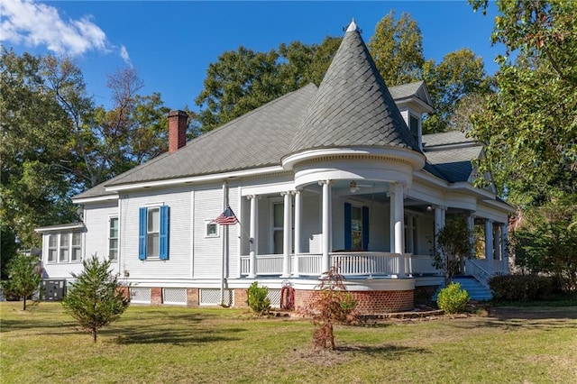 victorian home with covered porch and a front yard