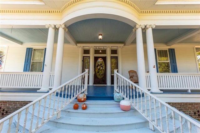 property entrance with covered porch