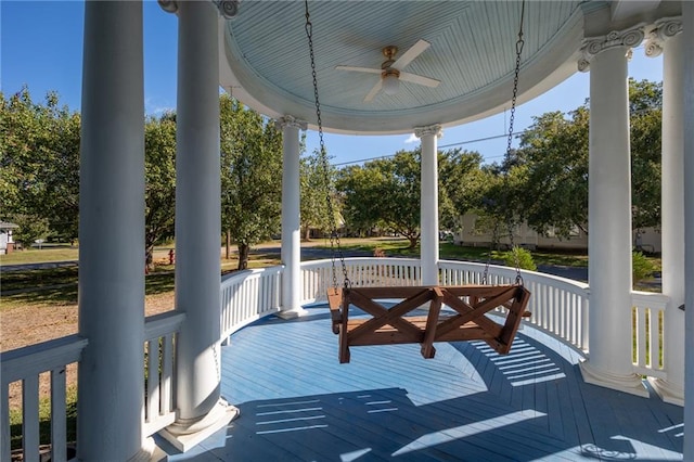 wooden deck featuring ceiling fan and covered porch