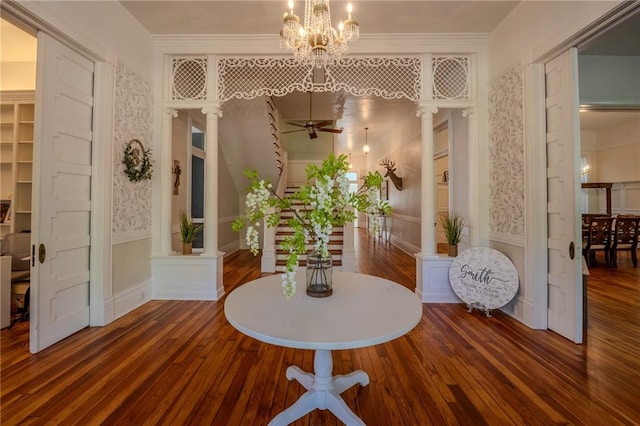 hall featuring dark wood-type flooring and a chandelier