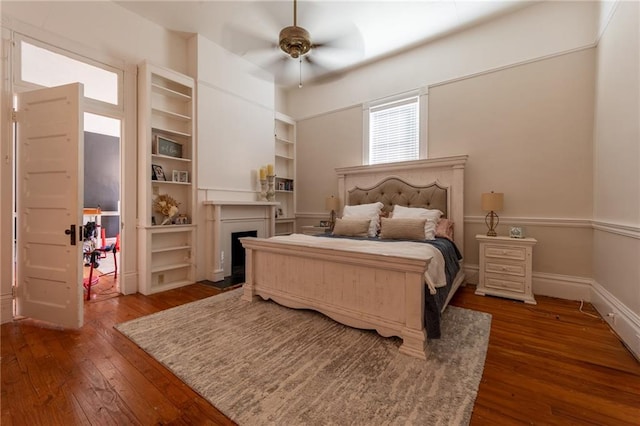 bedroom featuring ceiling fan and dark hardwood / wood-style floors