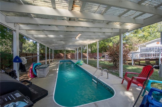 view of pool featuring a patio area, a deck, and a pergola