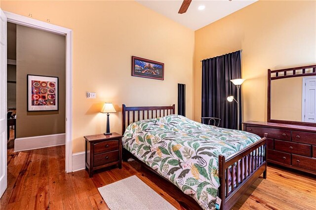 bedroom featuring wood-type flooring and ceiling fan