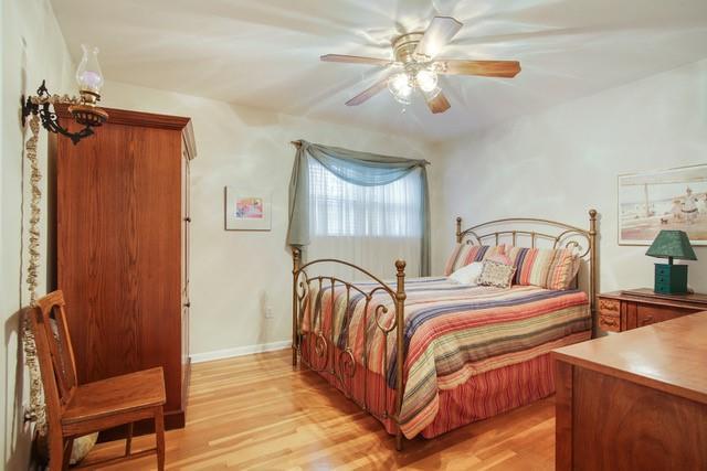 bedroom featuring ceiling fan and light hardwood / wood-style floors