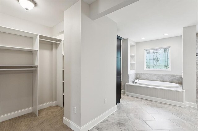 spacious closet featuring light tile patterned floors