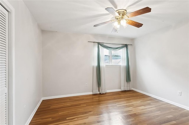 spare room with light wood-type flooring and ceiling fan