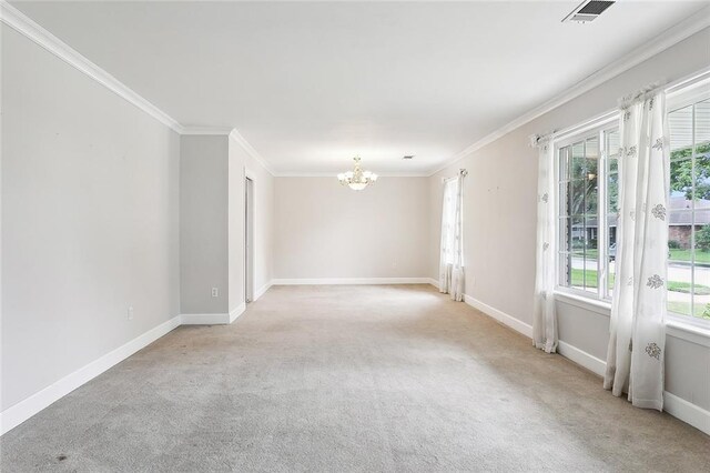 unfurnished room with light colored carpet, a notable chandelier, and ornamental molding