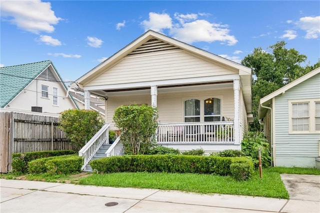 3712 Calhoun St, New Orleans, LA 70125 - view of front of house with covered porch and fence