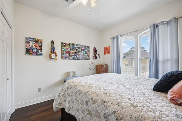 bedroom with a closet, ceiling fan, and dark hardwood / wood-style flooring