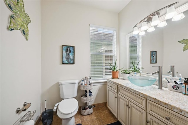 bathroom with vanity and toilet