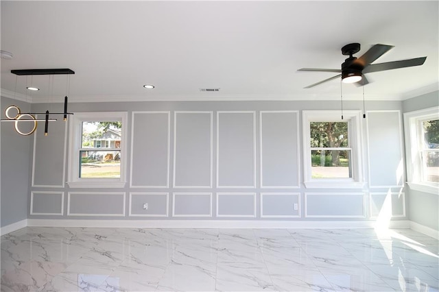 unfurnished room with crown molding and ceiling fan