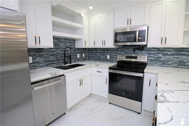 kitchen featuring sink, appliances with stainless steel finishes, white cabinets, light stone countertops, and backsplash